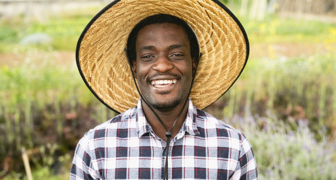 Happy African farmer working in farmhouse country - Farm people lifestyle concept