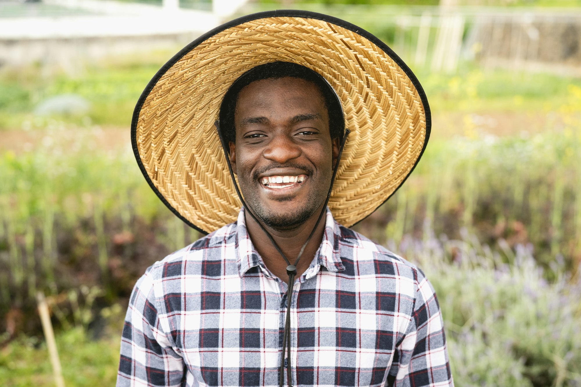 Happy African farmer working in farmhouse country - Farm people lifestyle concept